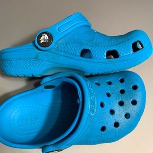Crocs size C9 blue.  Some wear but still have lots of use in them.